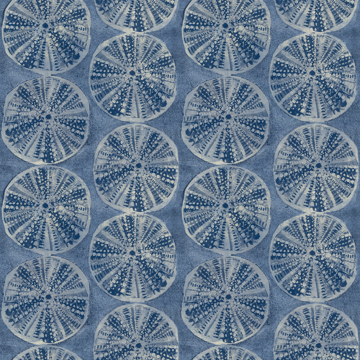 Chesapeake Sea Biscuit Sand Dollar Wallpaper by York Wallcoverings features a symmetrical, repeating pattern of circular sand dollar-like shapes in shades of blue and white, set against a textured blue background.