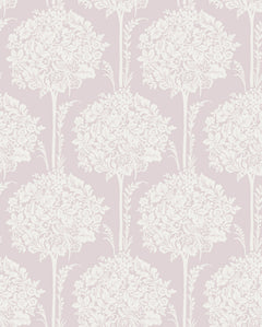 The Zaria Topiary Wallpaper by York Wallcoverings features an ornate white floral bouquet and leaf motif arranged in a seamless, repeating vertical pattern on a soft, pale pink background.