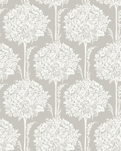 The Zaria Topiary Wallpaper by York Wallcoverings features a repeating pattern of white floral bouquets with leaves and stems on a light grey background, creating a vintage-inspired design.