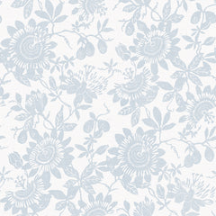 Helen Floral Trail Wallpaper by York Wallcoverings features a delicate, vintage-inspired design with large blooming flowers, leaves, and small fruit in a light blue floral pattern set against a white background.
