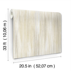 The Elysian Ikat Wallpaper by York Wallcoverings features a beige design with vertical stripes and comes in a roll measuring 33 feet (10.06 m) long and 20.5 inches (52.07 cm) wide.