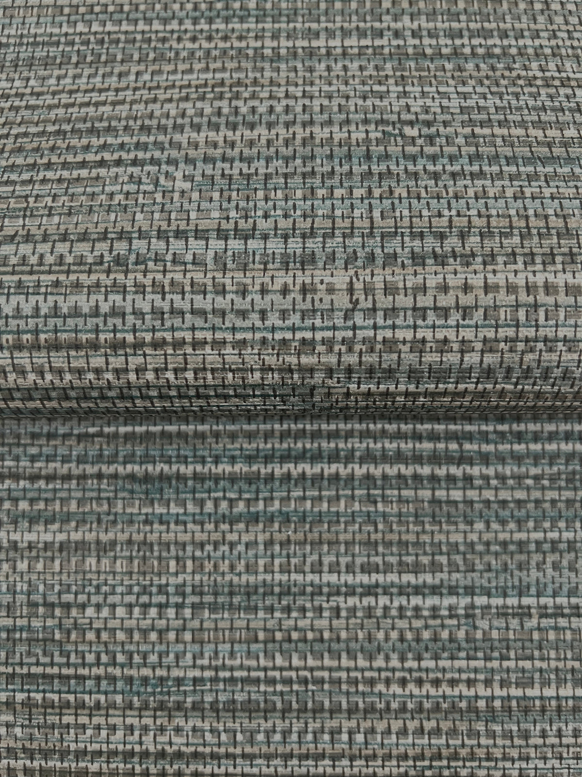 Winn Faux Grasscloth Wallpaper featuring a textured, woven pattern in shades of grey, blue, and black.