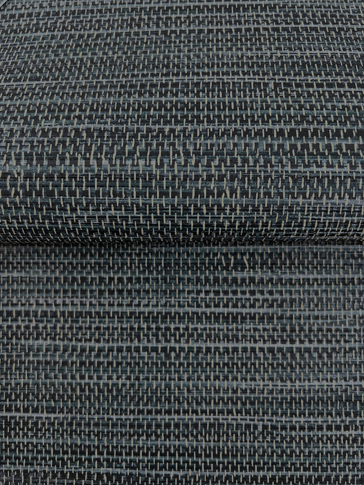 Winn Faux Grasscloth Wallpaper in dark blue, featuring a woven, grid-like texture and light gray vertical stitching.