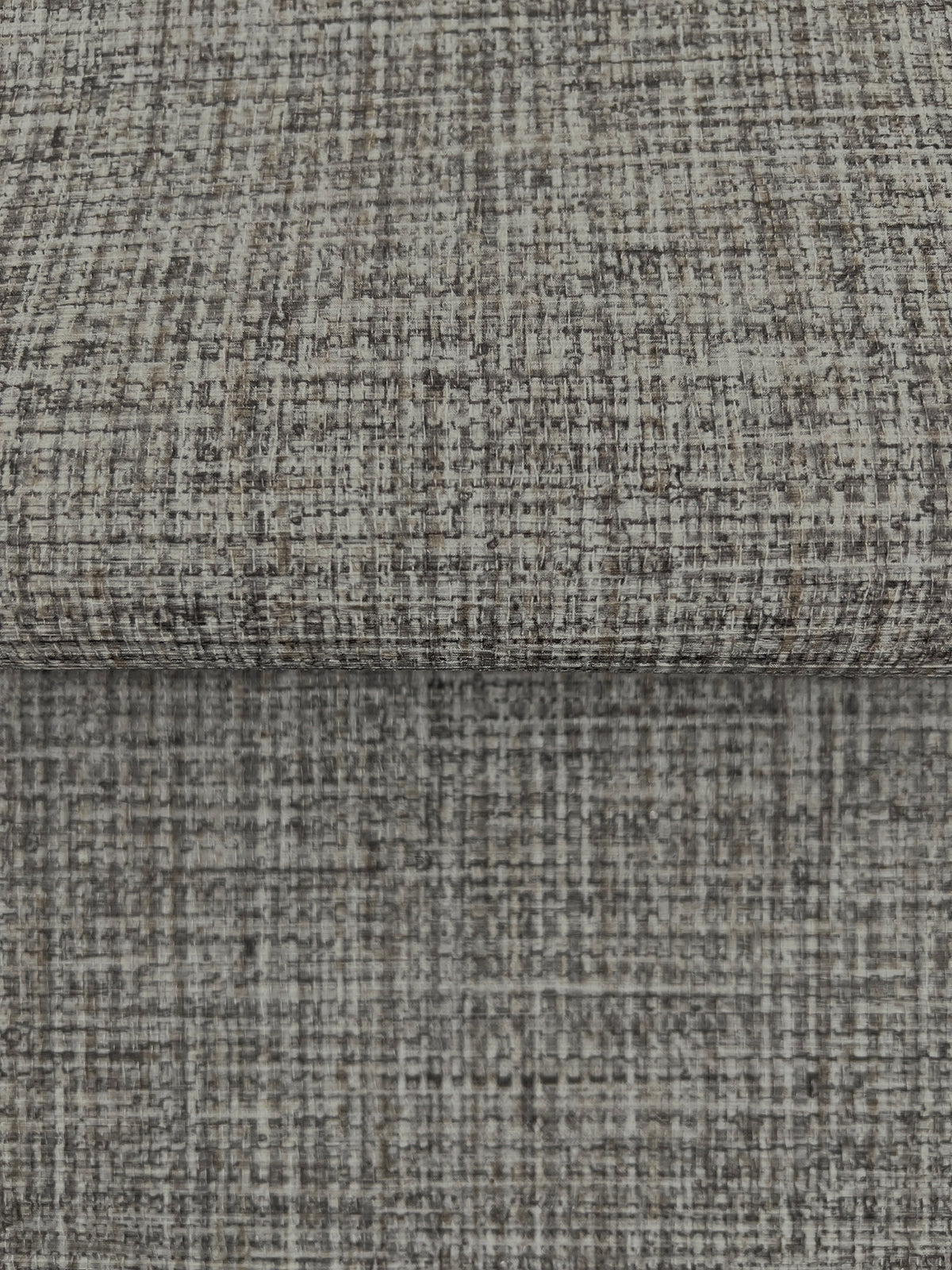 Close-up of gray Clarkson Woven Wallpaper featuring a textured, woven crosshatch pattern.