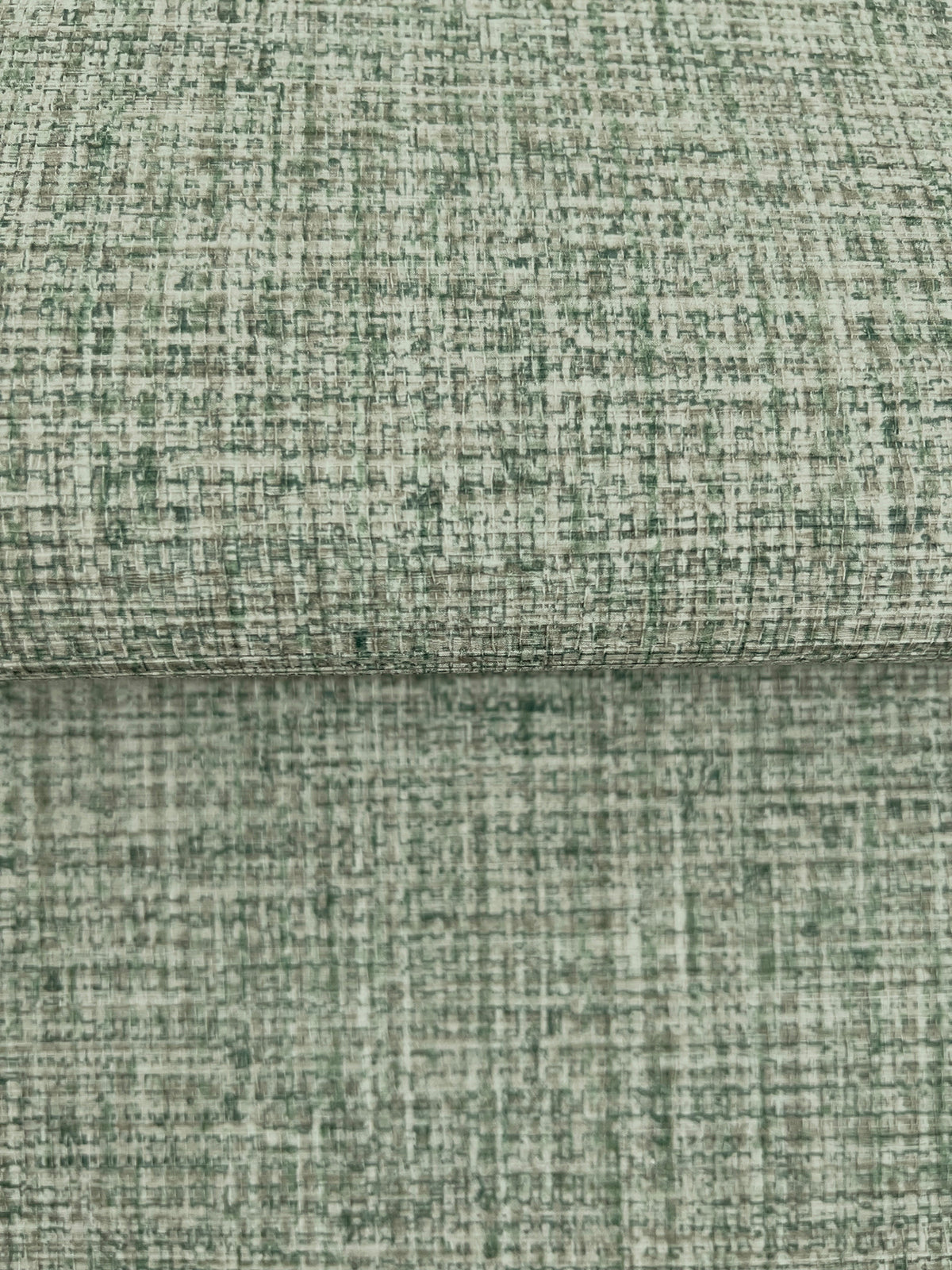 Clarkson Woven Wallpaper with a green and off-white cross-hatched textured pattern.