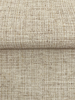 A close-up of Clarkson Woven Wallpaper, showing folded sheets with a textured, neutral-toned woven fabric pattern.