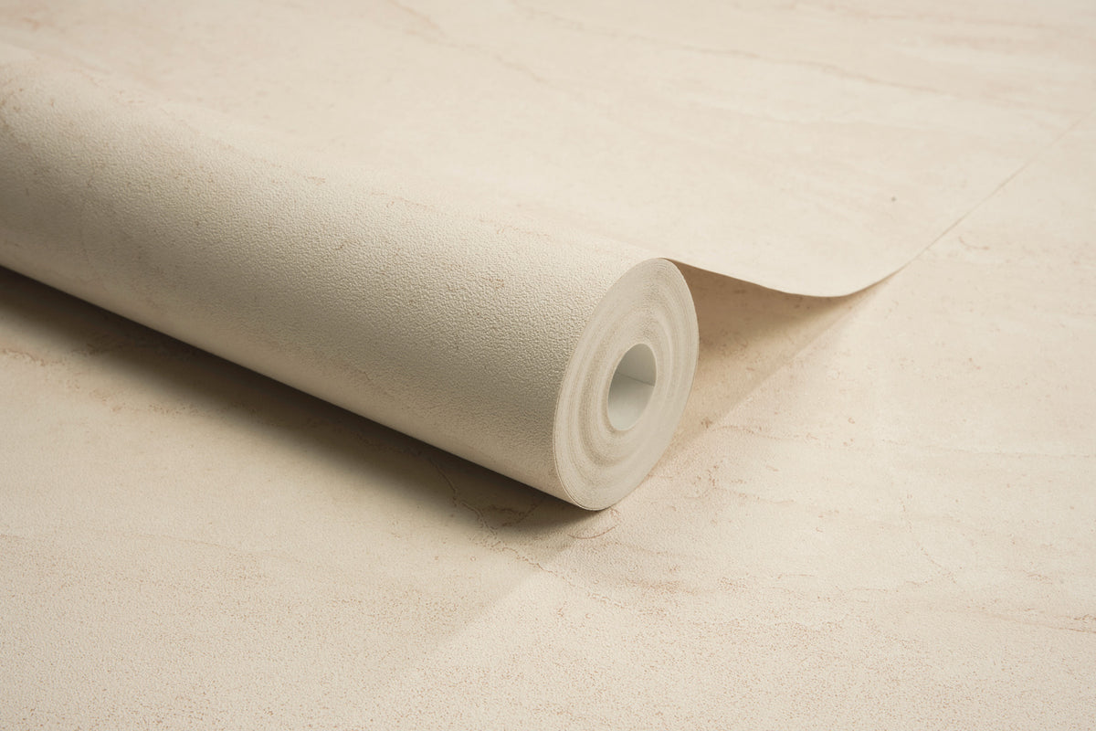 A close-up of the Chesapeake Morgana Stone Wallpaper by York Wallcoverings, partially unrolled on a matching flat surface.