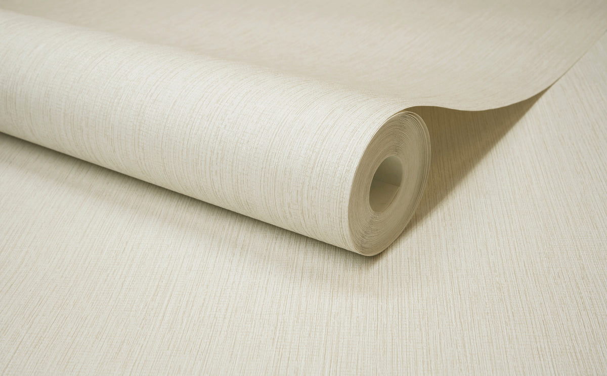 A roll of York Wallcoverings Chesapeake Elijah Texture Wallpaper in light beige is partially unrolled on a flat surface, displaying its subtle vertical pattern and smooth finish.