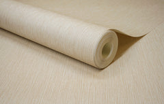 A close-up of a roll of Chesapeake Elijah Texture Wallpaper by York Wallcoverings, featuring a beige color with a subtle, textured horizontal line pattern, partially unrolled on a flat surface.