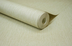 A close-up of a roll of York Wallcoverings Chesapeake Elijah Texture Wallpaper in beige, partially unrolled on a matching flat surface.