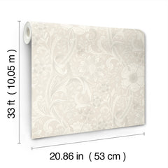 The Chesapeake Liora Floral Trail Wallpaper by York Wallcoverings is displayed in a beige color with a subtle floral and leaf pattern. Each roll measures 33 ft (10.05 m) in length and 20.86 in (53 cm) in width.