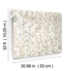 The Chesapeake Laverne Wildflowers Wallpaper by York Wallcoverings features a beige background with a blue and brown floral pattern. Each roll measures 33 feet (10.05 meters) in length and 20.86 inches (53 centimeters) in width.