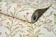 Experience the Chesapeake Laverne Wildflowers Wallpaper by York Wallcoverings, featuring a floral pattern in green, pink, and beige hues with delicate leaves and flowers on a light background.