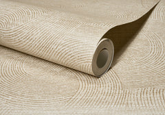 A partially unrolled roll of Chesapeake Harrison Swirling Geometric Wallpaper by York Wallcoverings, featuring a beige hue with a textured circular line pattern on a coordinated background.