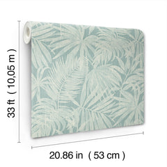 Chesapeake Sonny Fronds Wallpaper by York Wallcoverings features a pale leaf pattern in light blue and white, and comes in a roll measuring 33 ft (10.05 m) long and 20.86 in (53 cm) wide.