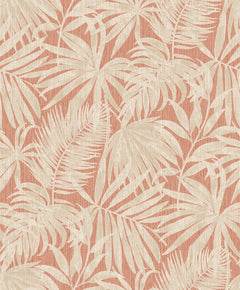 The Chesapeake Sonny Fronds Wallpaper by York Wallcoverings features cream-colored tropical leaves and palm fronds set against a textured, muted coral background for a vintage botanical look.