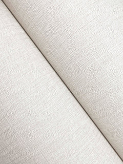 Close-up of two cream-colored Chesapeake Sonia Faux Linen Wallpaper surfaces by York Wallcoverings intersecting diagonally, highlighting a fine crosshatch pattern and soft lighting.