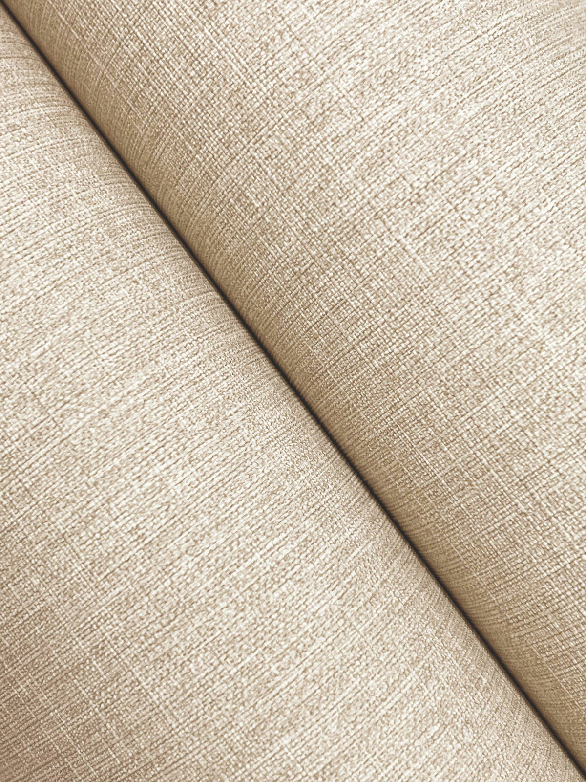 Close-up of two rolls of Chesapeake Sonia Faux Linen Wallpaper by York Wallcoverings intersecting diagonally, highlighting the fine woven fibers and crosshatch pattern on the surface.