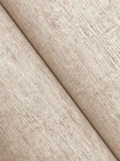Close-up of two sheets of Chesapeake Tansy Distressed Wallpaper by York Wallcoverings in beige, showcasing a textured, fibrous surface and a visible diagonal seam at the center.