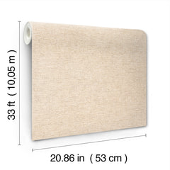 The Chesapeake Tansy Distressed Wallpaper by York Wallcoverings is shown in beige, partially unrolled to reveal its texture and substantial size. Each roll measures 33 feet (10.05 m) in length and 20.86 inches (53 cm) in width.