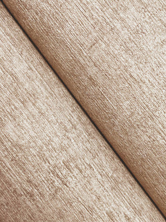 Close-up of Chesapeake Tansy Distressed Wallpaper by York Wallcoverings, featuring a light brown, textured woodgrain design with a diagonal seam that mimics two wooden planks for a rustic and natural look.