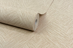 A roll of Chesapeake Hollis Textured Diamond Wallpaper by York Wallcoverings, featuring a beige geometric texture, is partially unrolled on a matching surface.