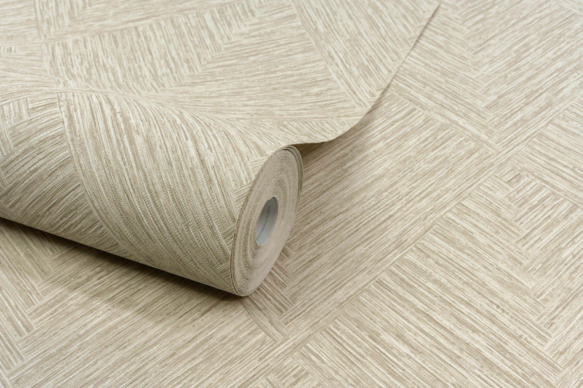 A close-up of the Chesapeake Hollis Textured Diamond Wallpaper by York Wallcoverings, featuring a beige geometric woven pattern, partially unrolled on a coordinating background.