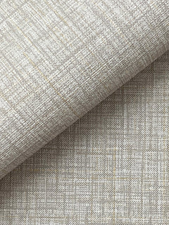 Close-up of Beau Faux Fabric Wallpaper by York Wallcoverings in textured beige, featuring a subtle plaid pattern and showcasing the woven detail with a gentle fold in the material.