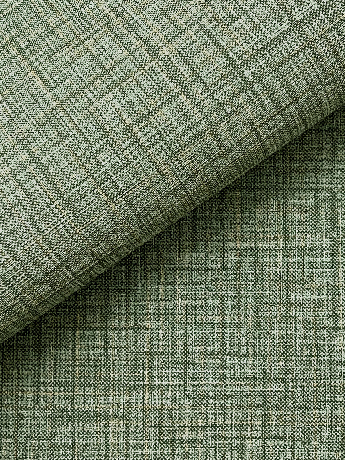 Close-up of Beau Faux Fabric Wallpaper by York Wallcoverings in light green, featuring a subtle grid pattern and two overlapping layers. The wallpaper’s textured weave and fine intersecting lines create a geometric, modern appearance.