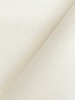 A close-up of York Wallcoverings’ Woven Linen Wallpaper in a cream hue, featuring a slightly peeled-back corner that reveals the consistent pattern beneath. The surface displays a subtle, grid-like linen texture.