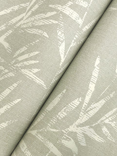 Close-up of Allerton Bamboo Wallpaper in light beige, showcasing a subtle, textured leaf pattern in cream tones with diagonal lines and overlapping bamboo leaves for a soft, natural look.