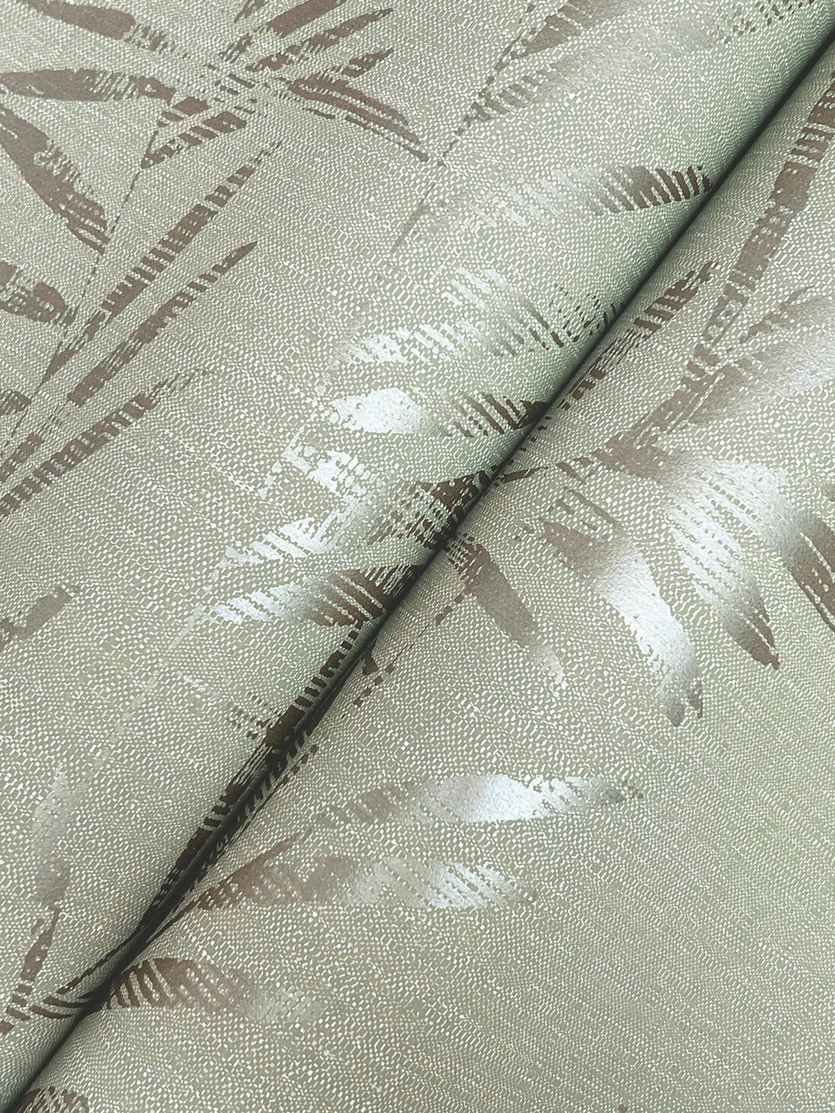 Close-up of the Allerton Bamboo Wallpaper, showcasing its textured surface with a metallic sheen and a subtle, abstract bamboo pattern in shades of light beige and silver.