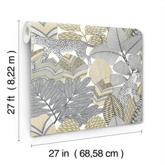 The Namiri Wallpaper by York Wallcoverings features a beige, gray, and black leafy pattern with a spotted leopard nestled among tropical leaves. Each roll measures 27 feet by 27 inches (8.22 meters by 68.58 centimeters).