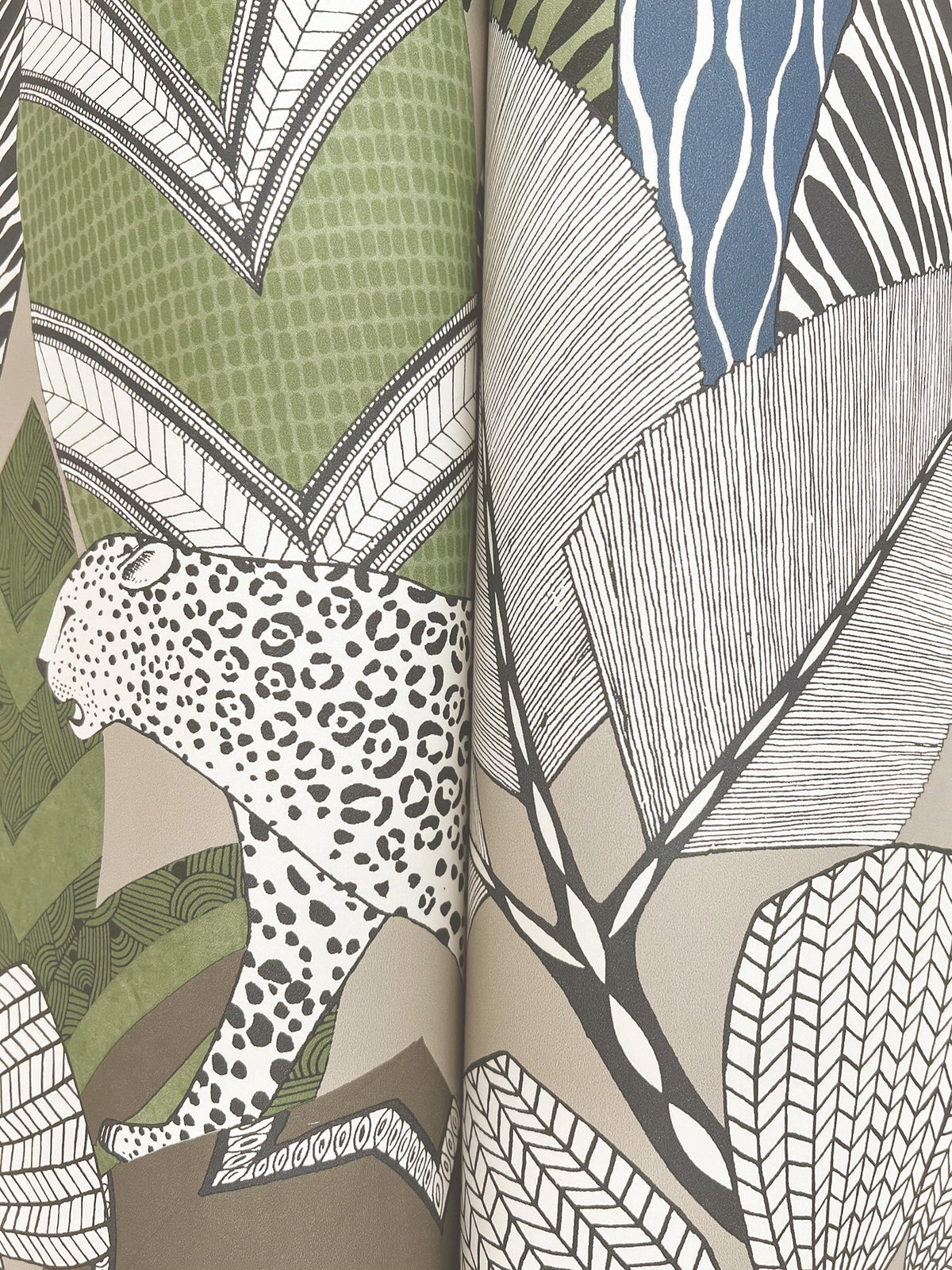 The Namiri Wallpaper by York Wallcoverings showcases a spotted leopard set among abstract, stylized leaves and plants rendered in green, beige, brown, white, and blue tones.