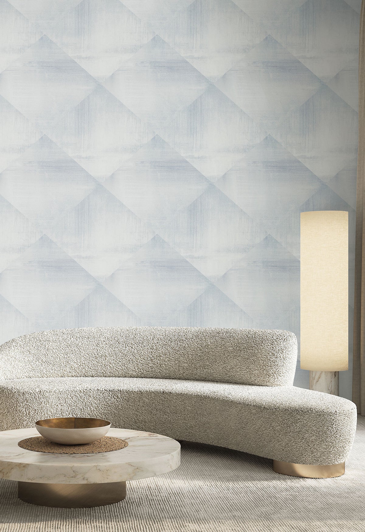 In Clay Wallpaper featuring a pale blue and white geometric diamond pattern behind a curved sofa, round coffee table, and floor lamp.