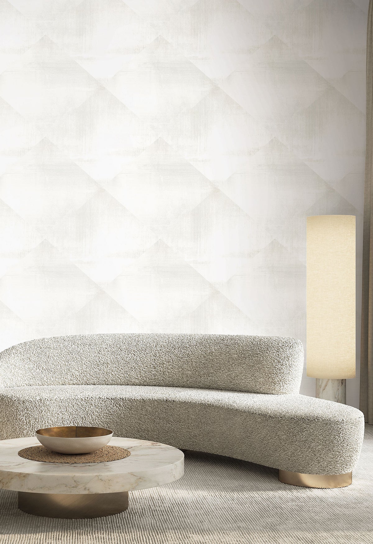In Clay Wallpaper featuring a subtle, light gray diamond pattern displayed behind a curved sofa, round stone coffee table, and floor lamp.