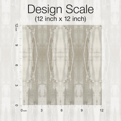 A square 12x12 inch fabric swatch of York Wallcoverings’ Escalante Wallpaper, featuring a muted, abstract beige and gray pattern, is displayed on a grid with inch measurements along the top and left edges. Text above reads Design Scale (12 inch x 12 inch).