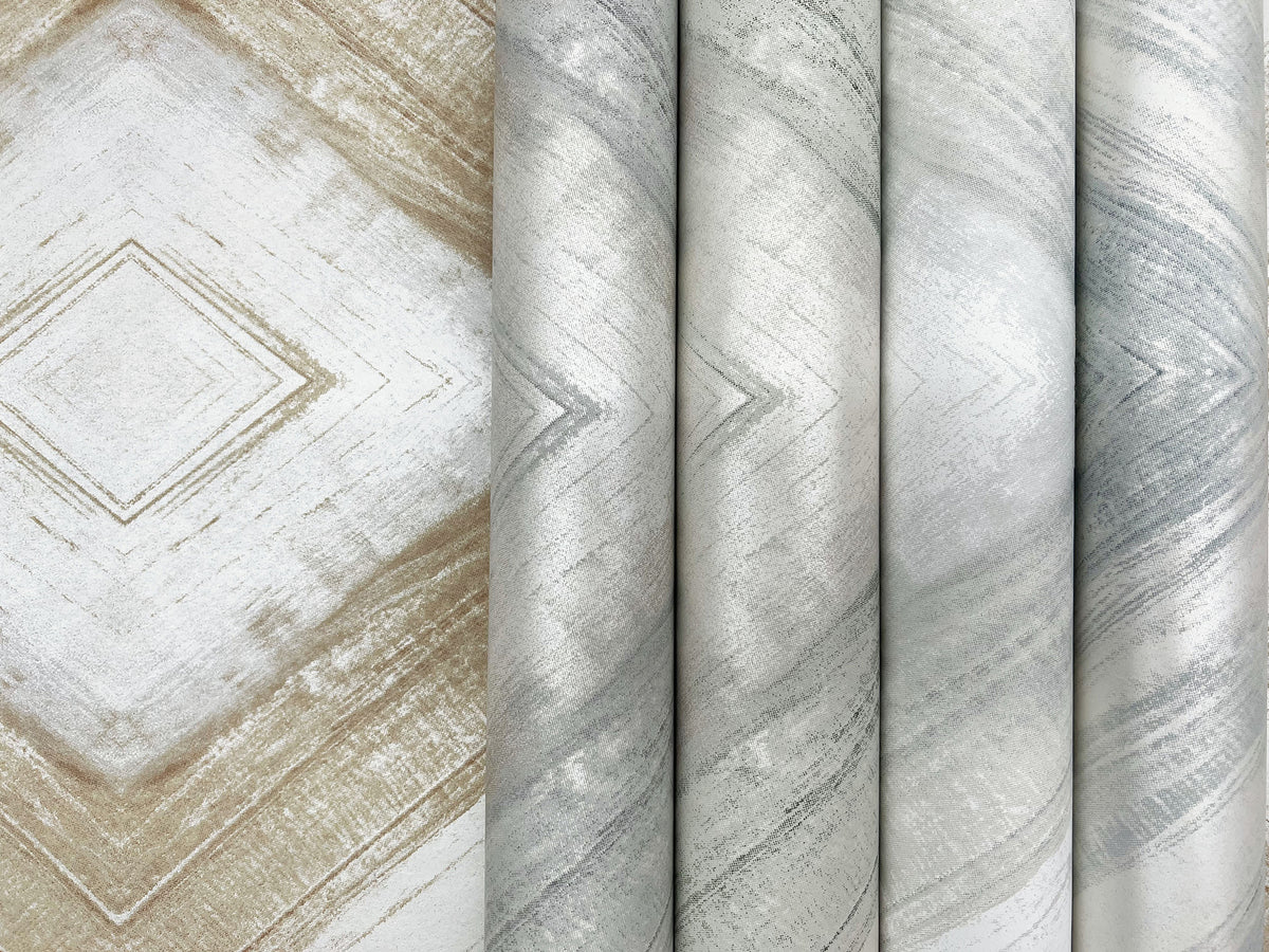 Ballad Wallpaper rolls showing a repeating diamond or chevron pattern in neutral shades of beige, gray, and silver.