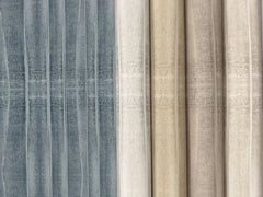 Five rolls of Grey Stone Wallpaper by York Wallcoverings, featuring vertical stone-like patterns in shades of grey, beige, and cream.