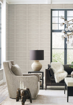 Living room with walls covered in Grey Stone Wallpaper by York Wallcoverings, featuring a light grey color and subtle horizontal wave pattern.