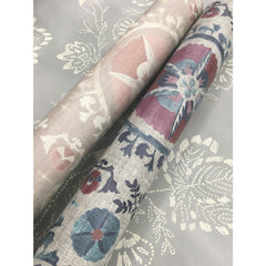 Two rolls of Barbier Wallpaper featuring a floral pattern in shades of blue, red, and beige, displayed against a matching light gray botanical print background.