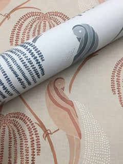 A roll of Blaise Wallpaper featuring a pattern of birds and foliage in shades of terracotta, grey, and white, resting on a matching flat sheet.