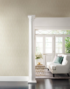 Candice Olson Café Society Wallpaper in light beige with a delicate, white vertical feather pattern covering a wall in a room featuring a white sofa and a column.