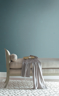 Candice Olson Diverging Diamonds Wallpaper in teal with a repeating gold geometric diamond pattern behind a neutral-toned chaise lounge.