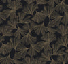 Gingko Toss Wallpaper by York Wallcoverings features an elegant and stylish botanical design with a seamless pattern of gold ginkgo leaves and fine lines on a black background.