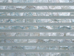 Sublime wallpaper featuring horizontal textured stripes and reflective stone-like mosaic tiles in blue and silver.