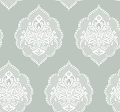 Experience timeless elegance with the Signet Medallion Damask Wallpaper by York Wallcoverings, featuring ornate white floral damask motifs set against a muted sage green background. This wallpaper’s evenly repeating design creates a sophisticated and vintage-inspired ambiance in any room.