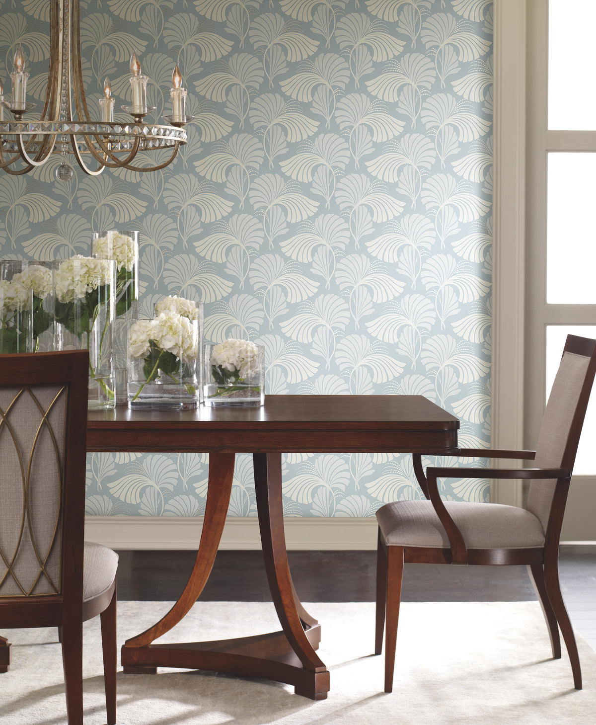 Dining room wall covered in Candice Olson Dancing Leaves Wallpaper, featuring a pale blue background with a white stylized fan-leaf pattern.