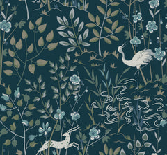Ronald Redding Aspen Wallpaper in dark teal features a heron standing by a stream and a small deer, surrounded by stylized flowers and leafy branches.
