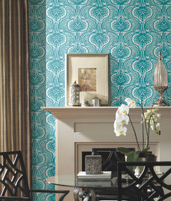 Ronald Redding Lotus Palm Wallpaper in teal and white with a repeating decorative botanical pattern installed behind a fireplace mantel.